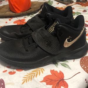 Lightly used gold and black kyries size 8